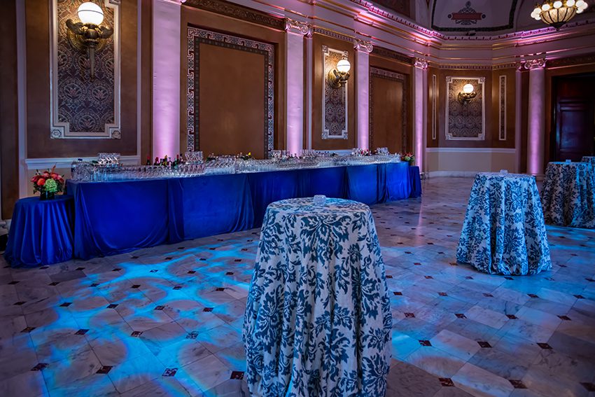 Cocktail Reception in Presidential Suite featuring Cocktail Tables, and Blue Up-Lighting.