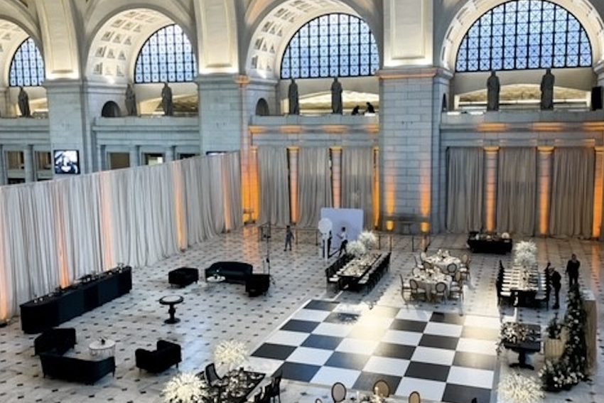Corporate Event in Main Hall-East with Trees, Hanging Greenery, Floral Centerpieces, and Candlelight.